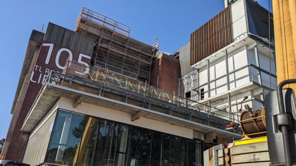 Temporary platforms and scaffolding around a university library building.